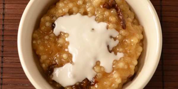 Sweet sago pudding with dried plums, coconut milk and jaggery (sago kanjee)